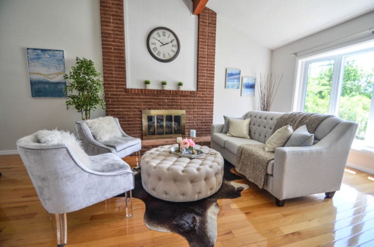 Living room with vaulted ceiling and fireplace